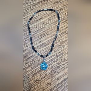 Handcrafted Black Beaded Necklace with Blue Flower Pendant